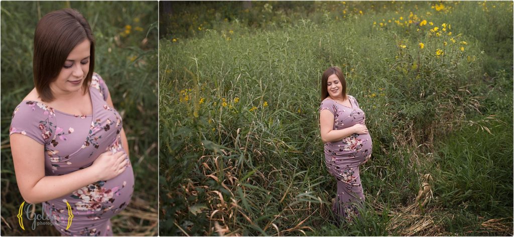 pregnant mom holding belly in a field outside Cary, Illinois