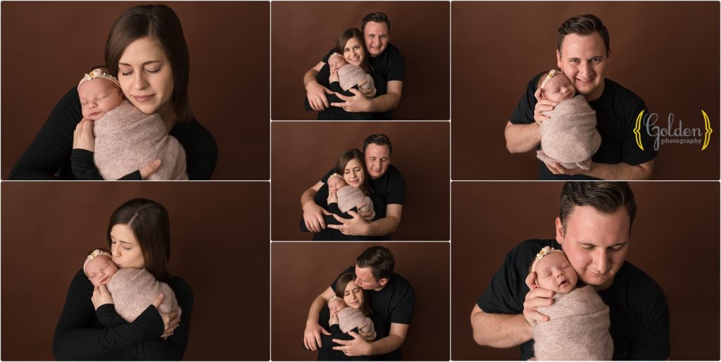 family holding new baby in photo studio in Lake County IL