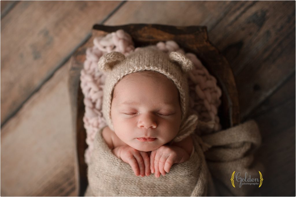 newborn baby asleep with animal bonnet in Lake County IL