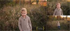 boy posing for family photos in field near Barrington IL