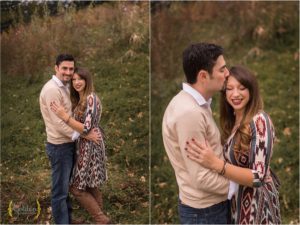 husband and wife cuddling for photos in field