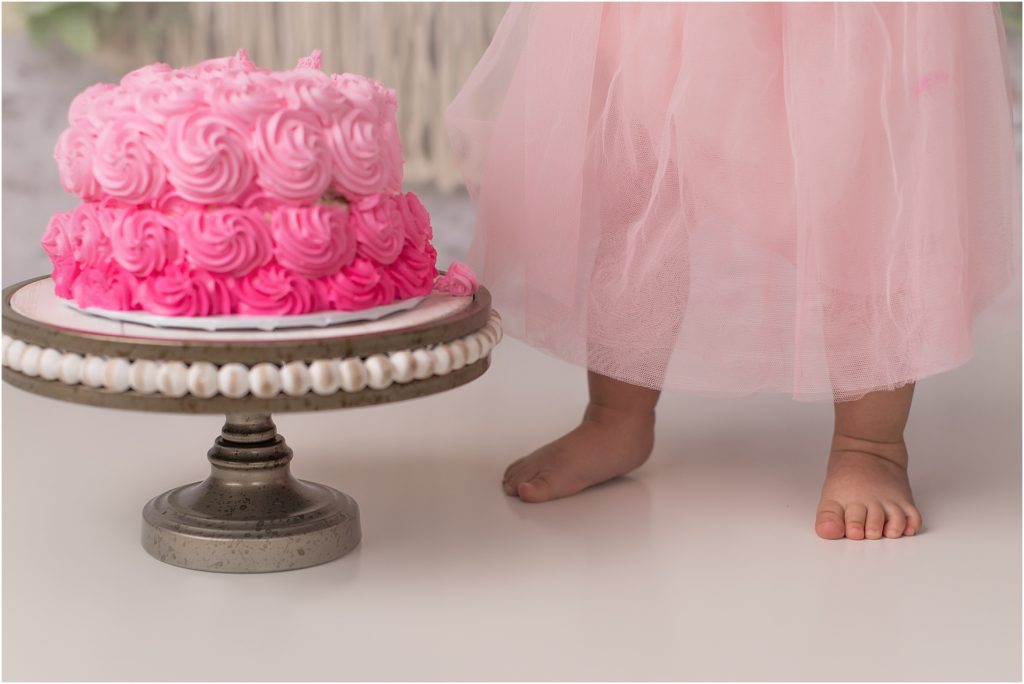 baby toes by 1st birthday cake