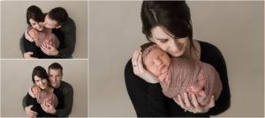 mom holding baby girl for posed newborn photos in Lake Zurich IL