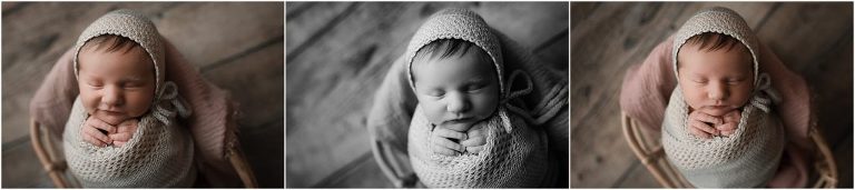 baby girl wrapped in grey during newborn photo shoot