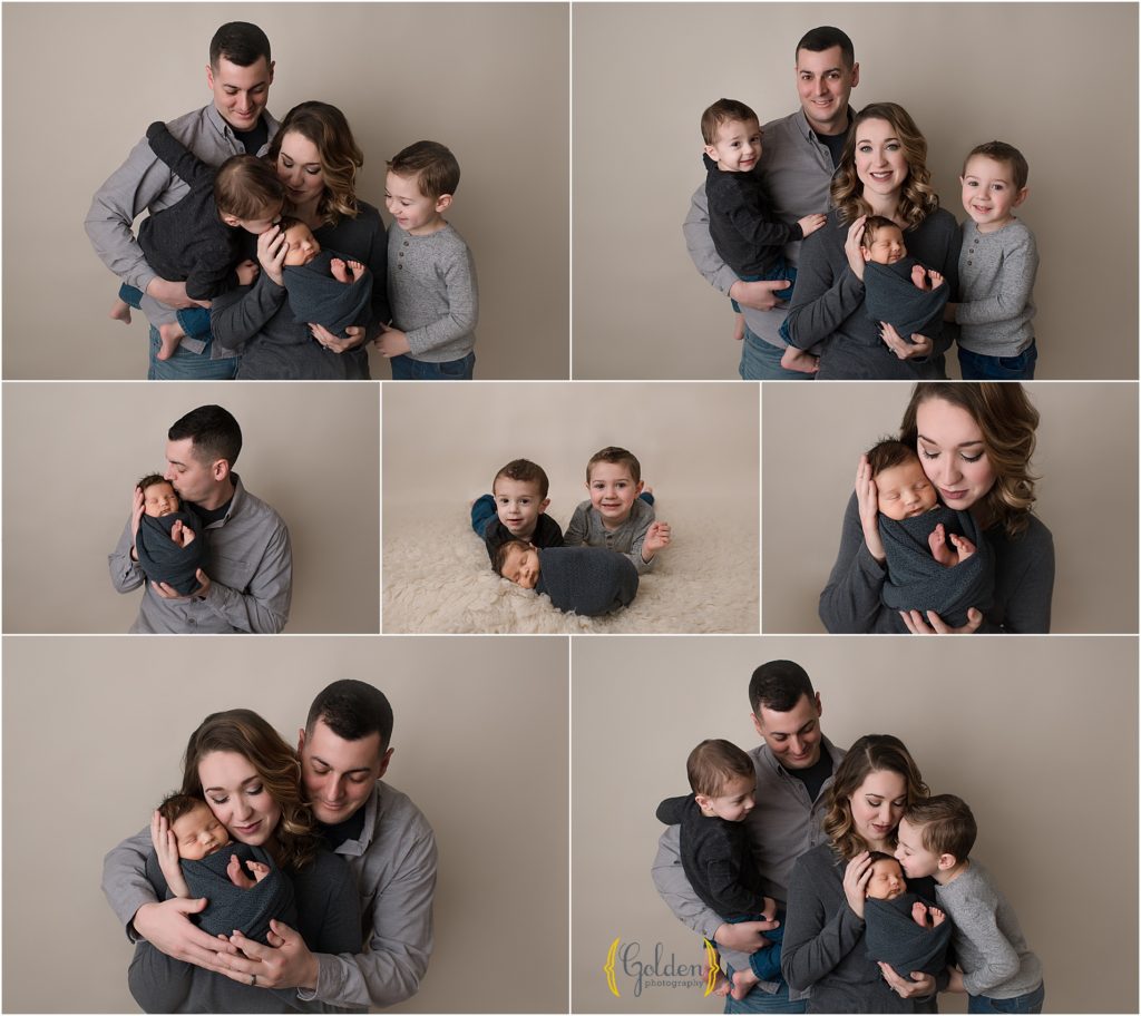 family of five posing for pictures with newborn baby brother in photo studio near Arlington Heights
