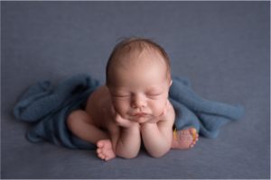 composite of baby in froggy pose on blue blanket near Lake Zurich IL