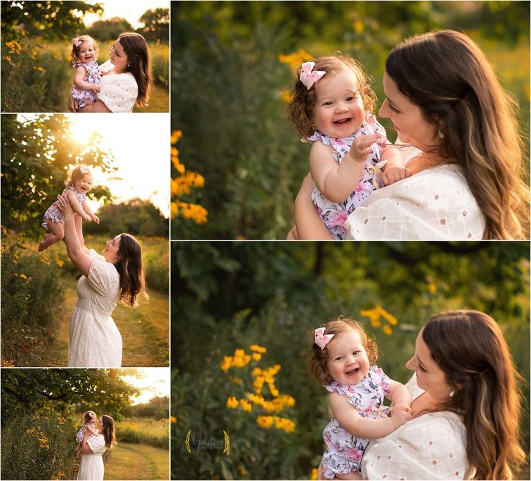 mom cuddling 1 year old daughter for outdoor family photos near Chicago