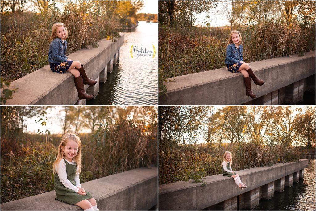 girls sitting on a ledge at a lake outside Chicago IL