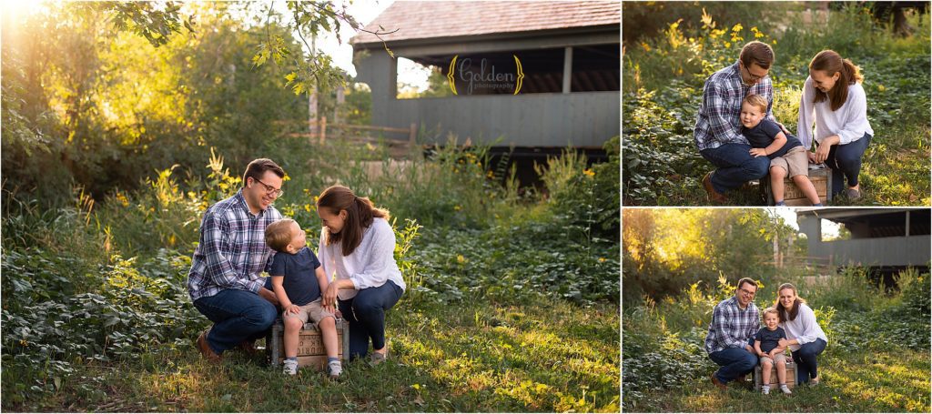 family of three by covered bridge for photography session in Long Grove IL
