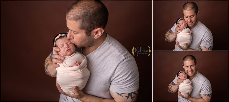 dad holding newborn baby girl during photo session for Algonquin IL photographer