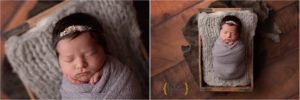 baby wrapped in grey cloth in wooden crate