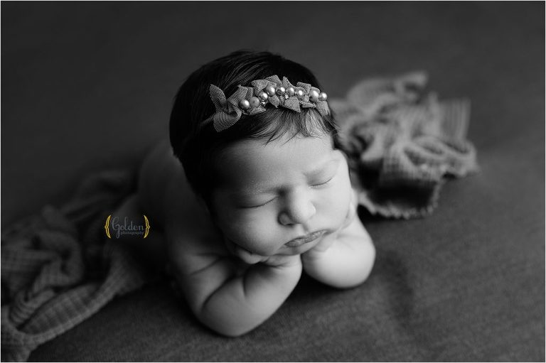 black and white composite image of newborn in photography studio