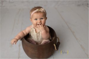 baby sitting in wooden bucket near Hawthorn Woods IL