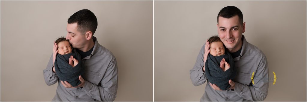 dad holding newborn baby