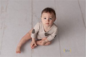 yung boy looking up at camera during photo session near Chicago IL