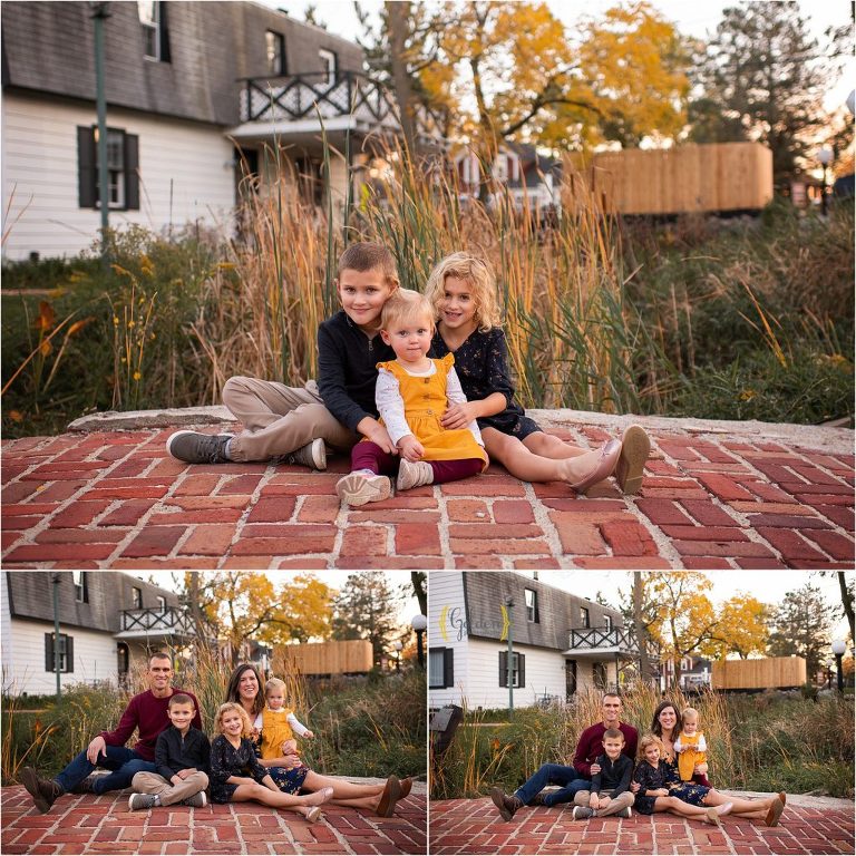 family sitting on brick path for family photos in Long Grove