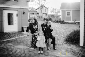 black and white candid photo of family in downtown Long Grove IL