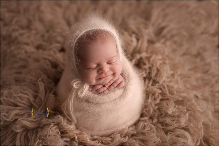smiling newborn baby in Arlington Heights IL photography studio