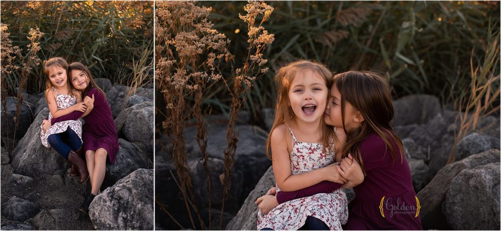 sisters sitting on rocks in Schaumburg IL park