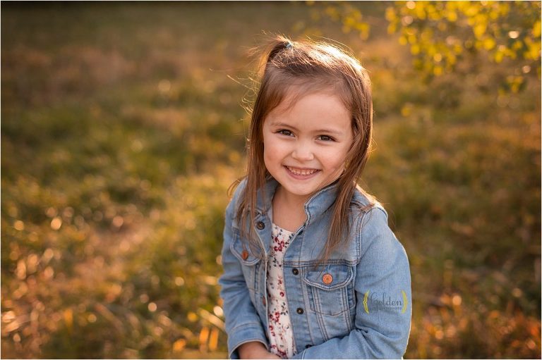 little girl smiling in outdoor park in Schaumburg