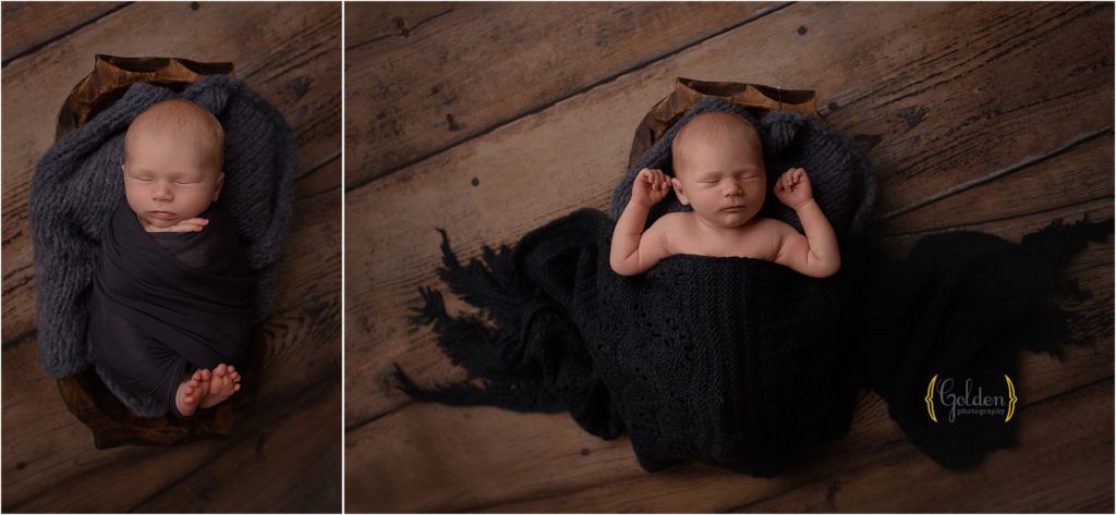 baby boy laying in wood bowl for newborn photos