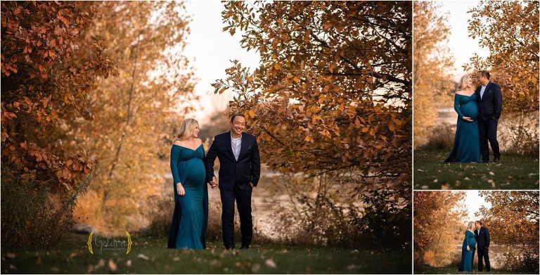 pregnant couple holding hands and walking during maternity photo session