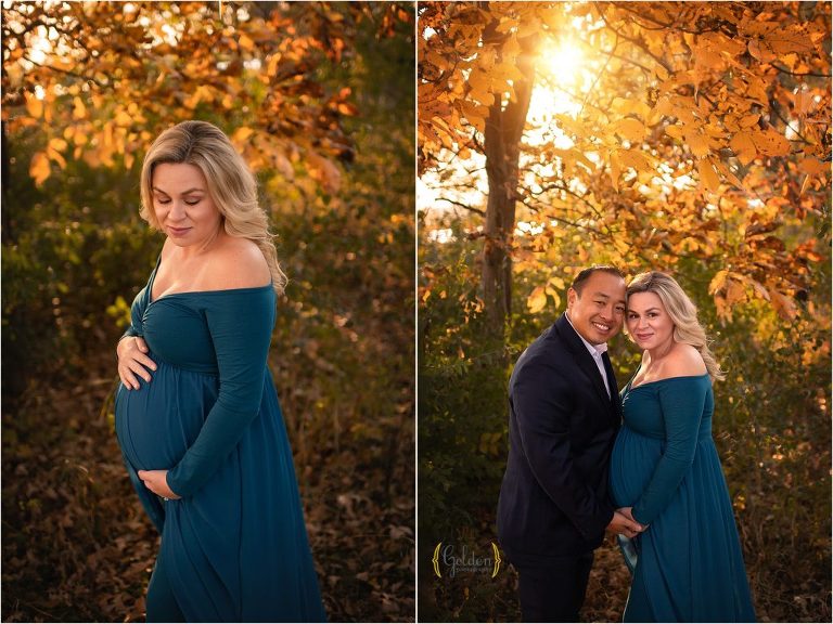 pregnant couple posed by a autumn tree at sunset