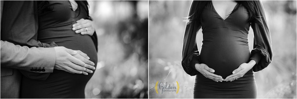 black and white of hands on pregnant belly