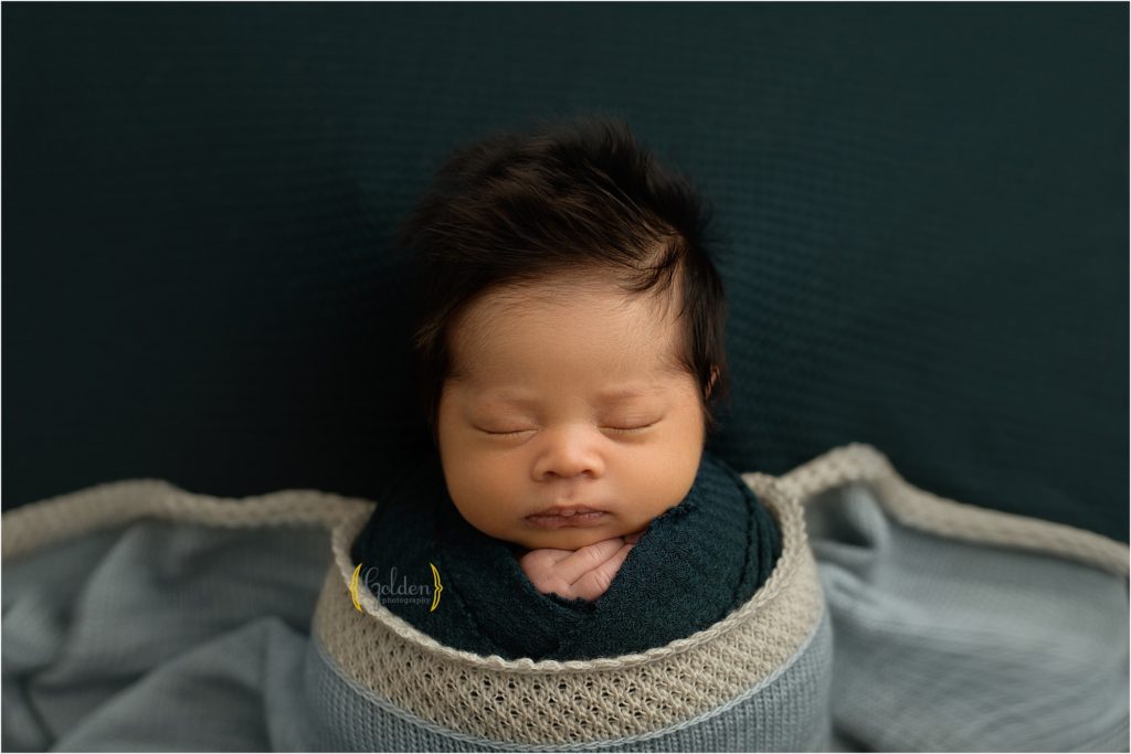 newborn wrapped in blue for baby photos with newborn photographer Lake Zurich IL